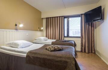 Фото номера Двухместный номер с 2 отдельными кроватями Отель Kultahippu Hotel &amp; Apartments г. Ивало 5